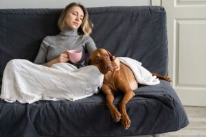 Sad woman sitting with dog know when owners are grieving pet intelligence emotional